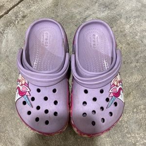 Used purple unicorn crocs. Size 9. Normal wear and tear.